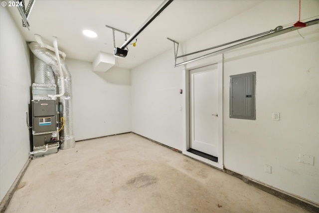 garage featuring electric panel and a garage door opener