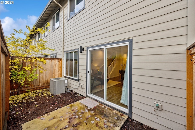 exterior space with cooling unit and a patio area