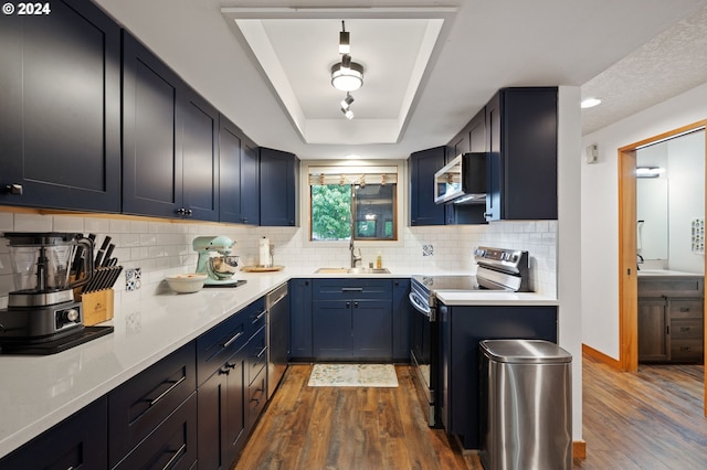 living area featuring a textured ceiling, wood finished floors, and visible vents