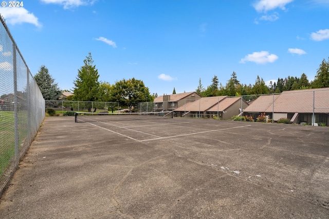 view of sport court featuring fence