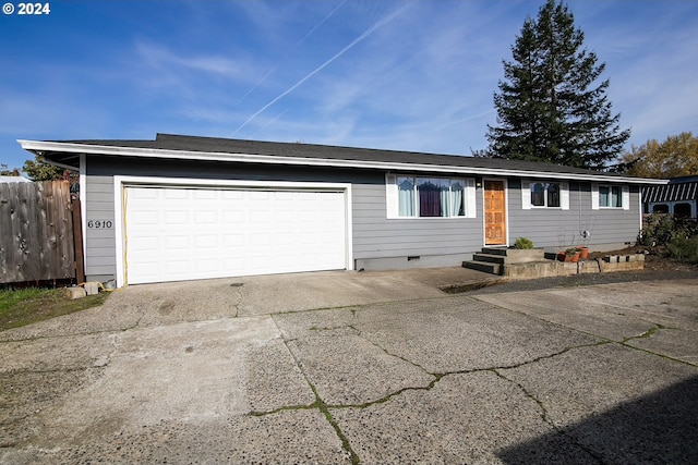 ranch-style home with a garage