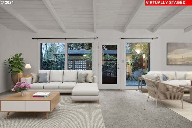 living room featuring lofted ceiling with beams and carpet floors