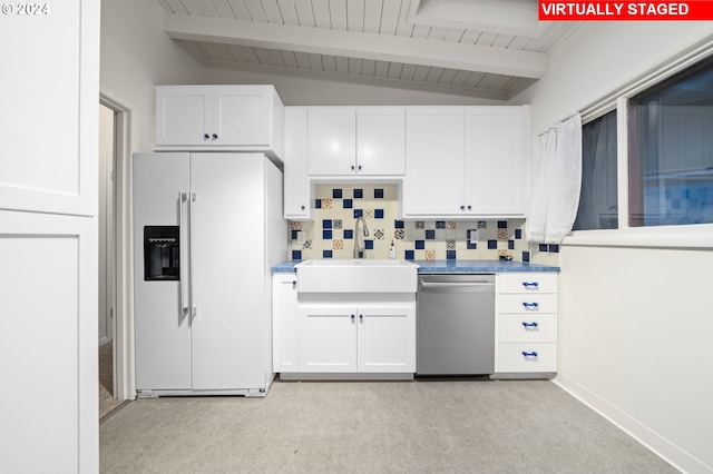 kitchen with stainless steel dishwasher, white cabinetry, a sink, and white fridge with ice dispenser
