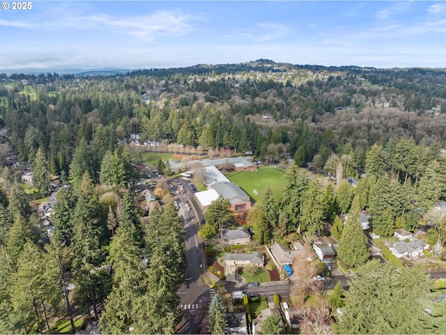 drone / aerial view with a view of trees