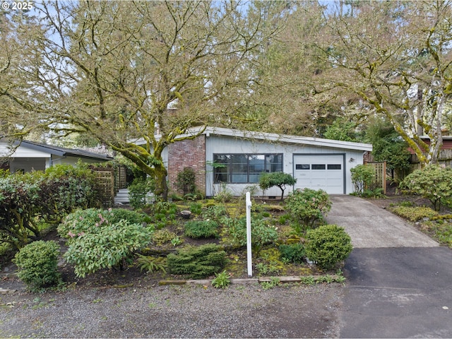 view of front facade with driveway and a garage