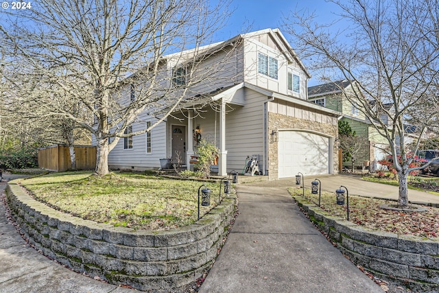 view of front of property with a front yard and a garage