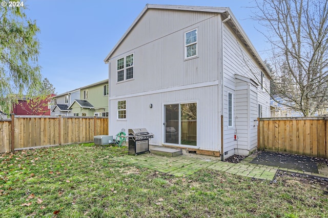 rear view of house with a lawn