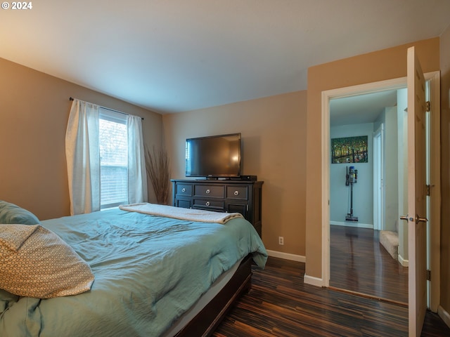 bedroom featuring dark wood-type flooring