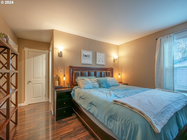 bedroom featuring dark hardwood / wood-style flooring