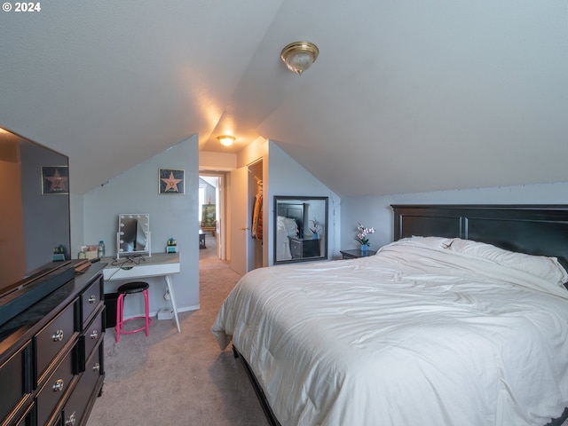 carpeted bedroom with vaulted ceiling