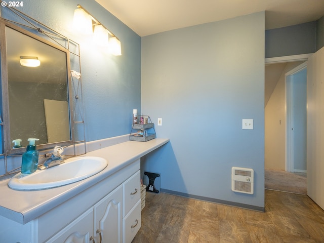 bathroom featuring vanity and heating unit