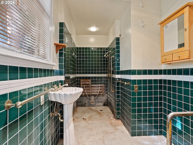 bathroom featuring tiled shower and tile walls