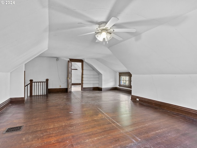 bonus room featuring ceiling fan, lofted ceiling, and dark hardwood / wood-style flooring