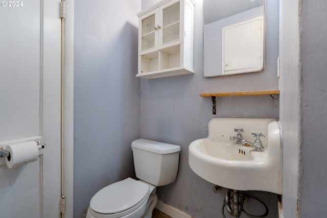 bathroom with toilet and sink