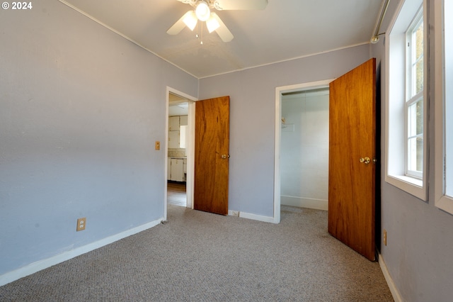 121 Garrett Ave, Klickitat, WA 98628 - unfurnished bedroom with carpet, baseboards, a closet, and ceiling fan