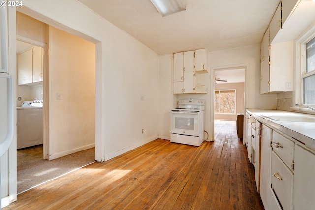 kitchen with washer / clothes dryer, sink, white cabinets, and white stove