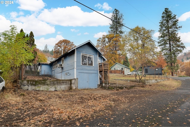 view of property exterior with a wooden deck