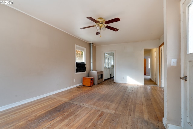 unfurnished living room featuring hardwood / wood-style flooring and ceiling fan