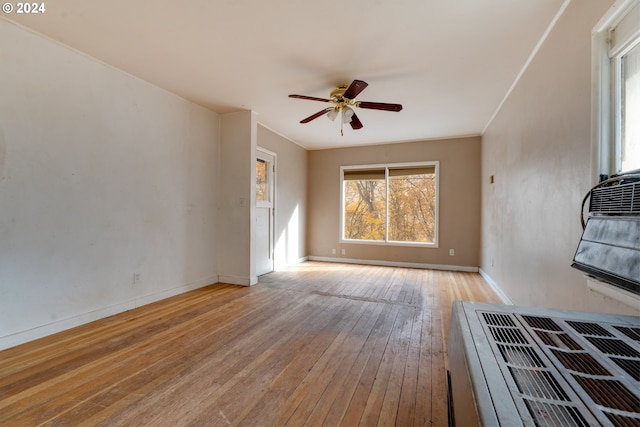 121 Garrett Ave, Klickitat, WA 98628 - unfurnished living room featuring a ceiling fan, wood-type flooring, baseboards, and ornamental molding