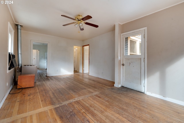 spare room with light hardwood / wood-style floors and ceiling fan