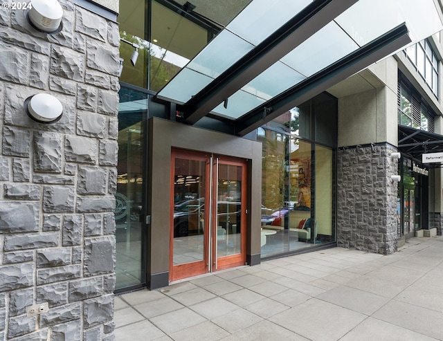 view of exterior entry featuring french doors