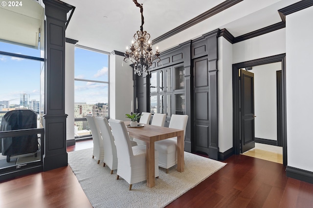 dining space featuring dark hardwood / wood-style floors, a wall of windows, a notable chandelier, and ornamental molding