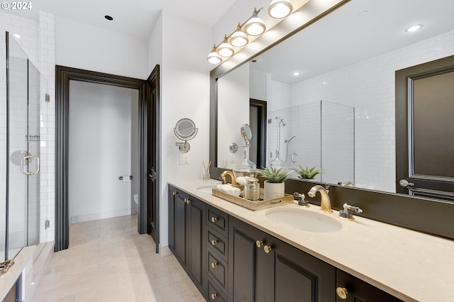 bathroom featuring walk in shower, toilet, tile patterned floors, and vanity