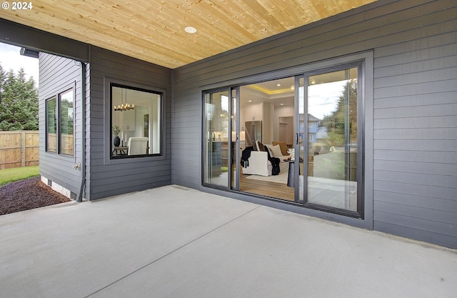 view of patio / terrace featuring fence