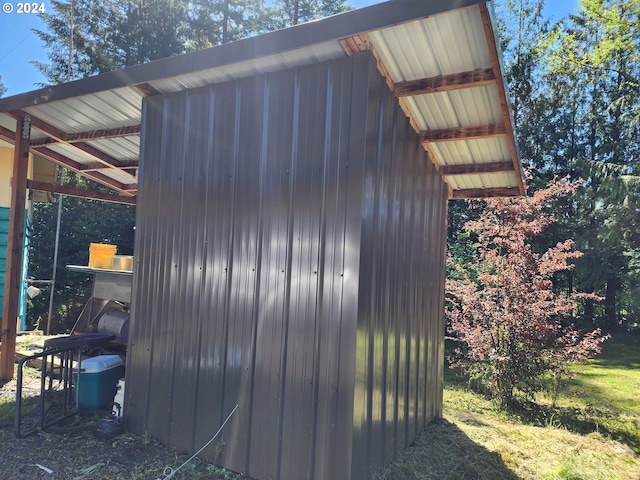 view of home's exterior with an outdoor structure