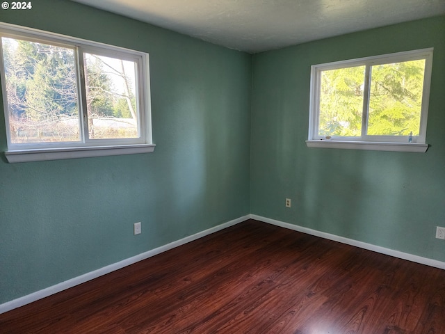 empty room featuring hardwood / wood-style floors