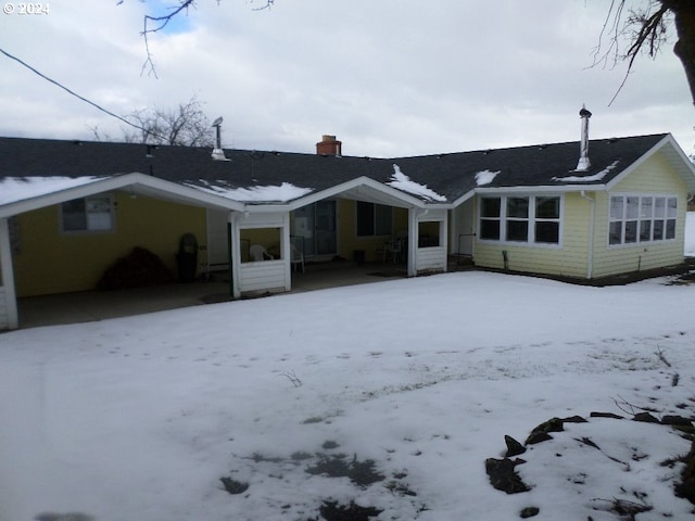 view of snow covered house