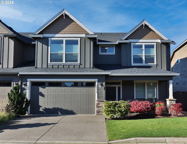 view of front facade with a garage and a front yard