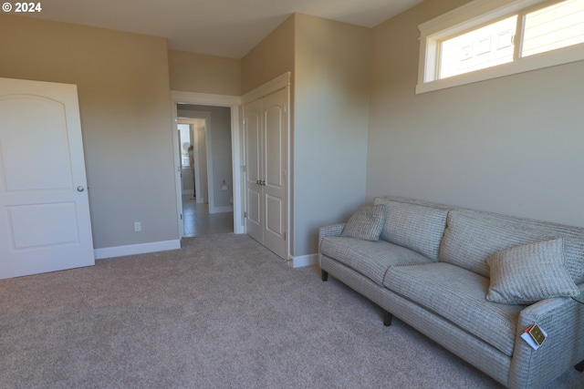 living area with light carpet