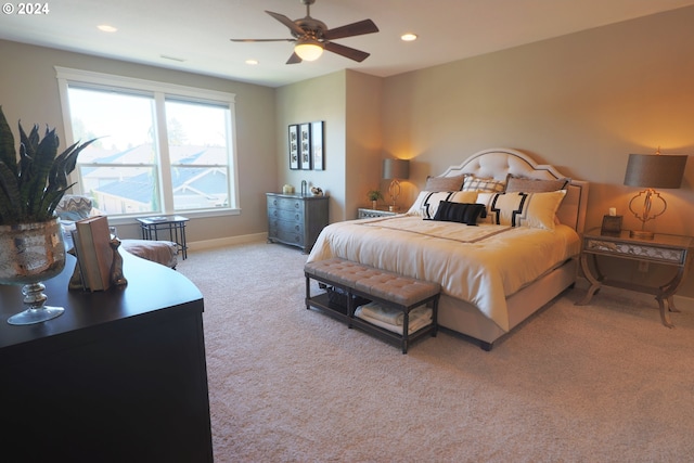 bedroom with light colored carpet and ceiling fan