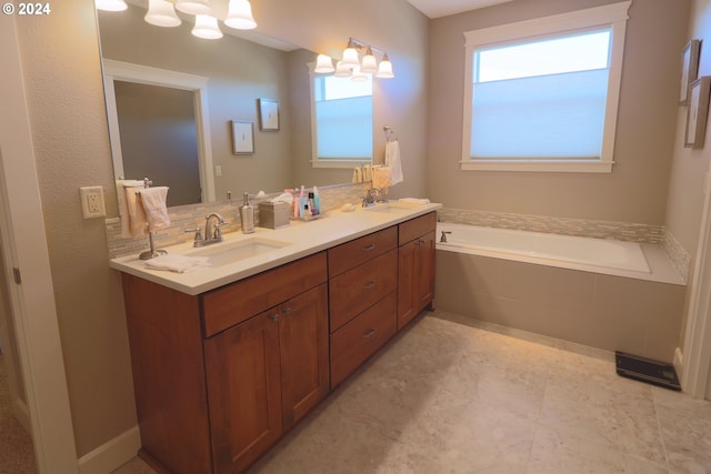 bathroom featuring vanity and a relaxing tiled tub