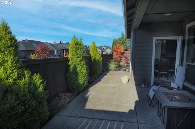 view of patio with an outdoor fire pit