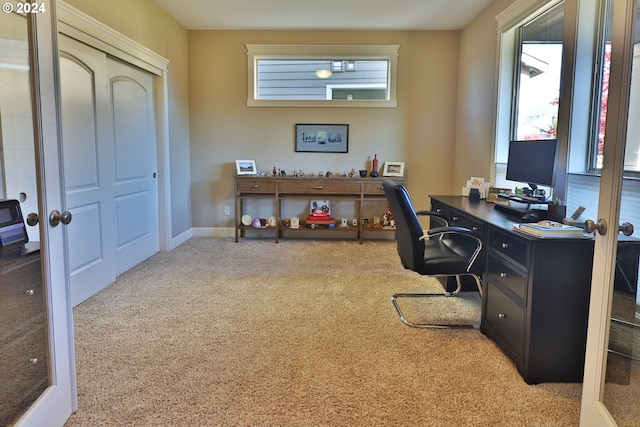 office space with french doors and light colored carpet