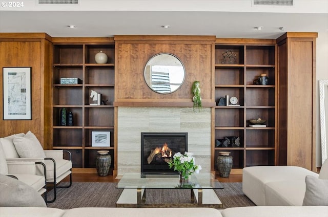 living room featuring a fireplace and dark hardwood / wood-style flooring