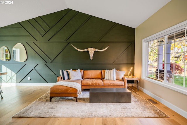 interior space featuring wood finished floors, baseboards, and a wealth of natural light