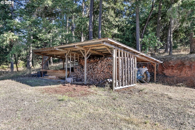 view of outbuilding with a carport