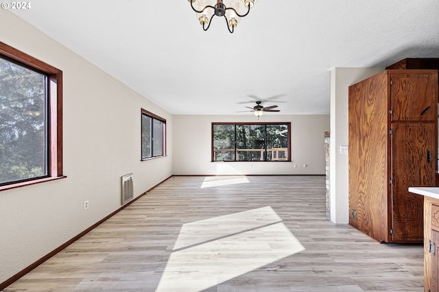 interior space with a wealth of natural light and light hardwood / wood-style floors