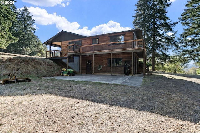 back of property with a patio