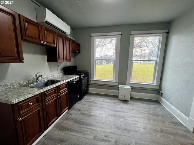 401 NW Bailey Ave, Pendleton, OR 97801 - kitchen featuring a sink, black appliances, healthy amount of natural light, and light countertops