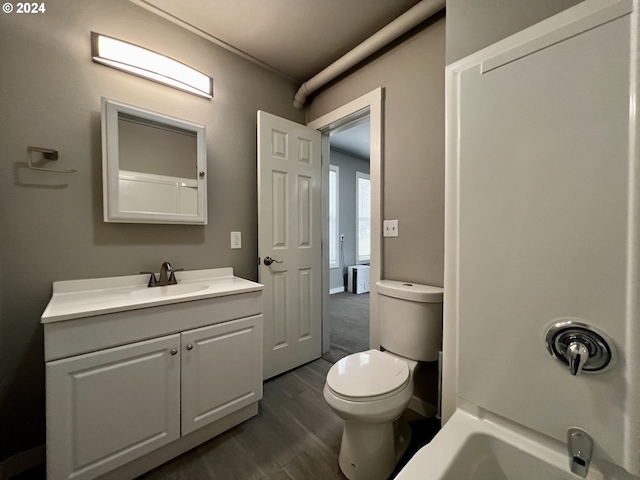 401 NW Bailey Ave, Pendleton, OR 97801 - full bathroom featuring vanity, toilet, and wood finished floors