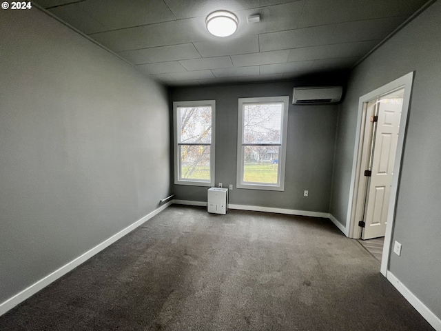 carpeted spare room with a wall mounted air conditioner