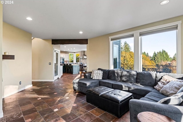 living room featuring beam ceiling