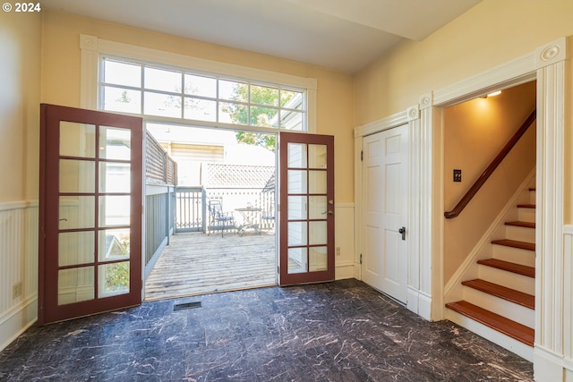 entryway featuring french doors and a wealth of natural light