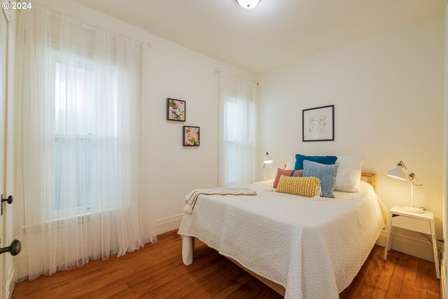 bedroom featuring dark wood-type flooring