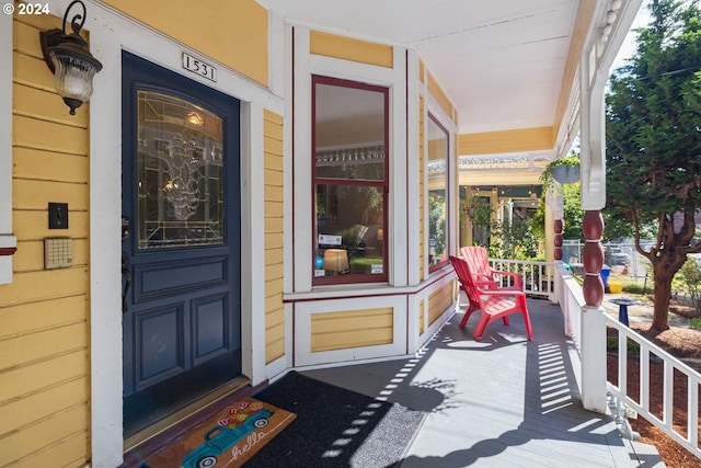 entrance to property featuring a porch