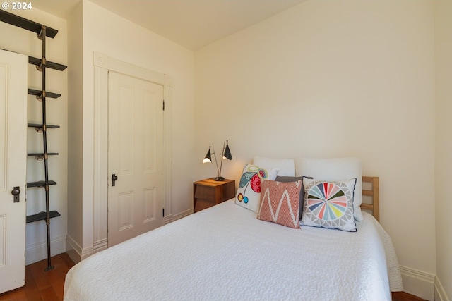 bedroom with wood-type flooring